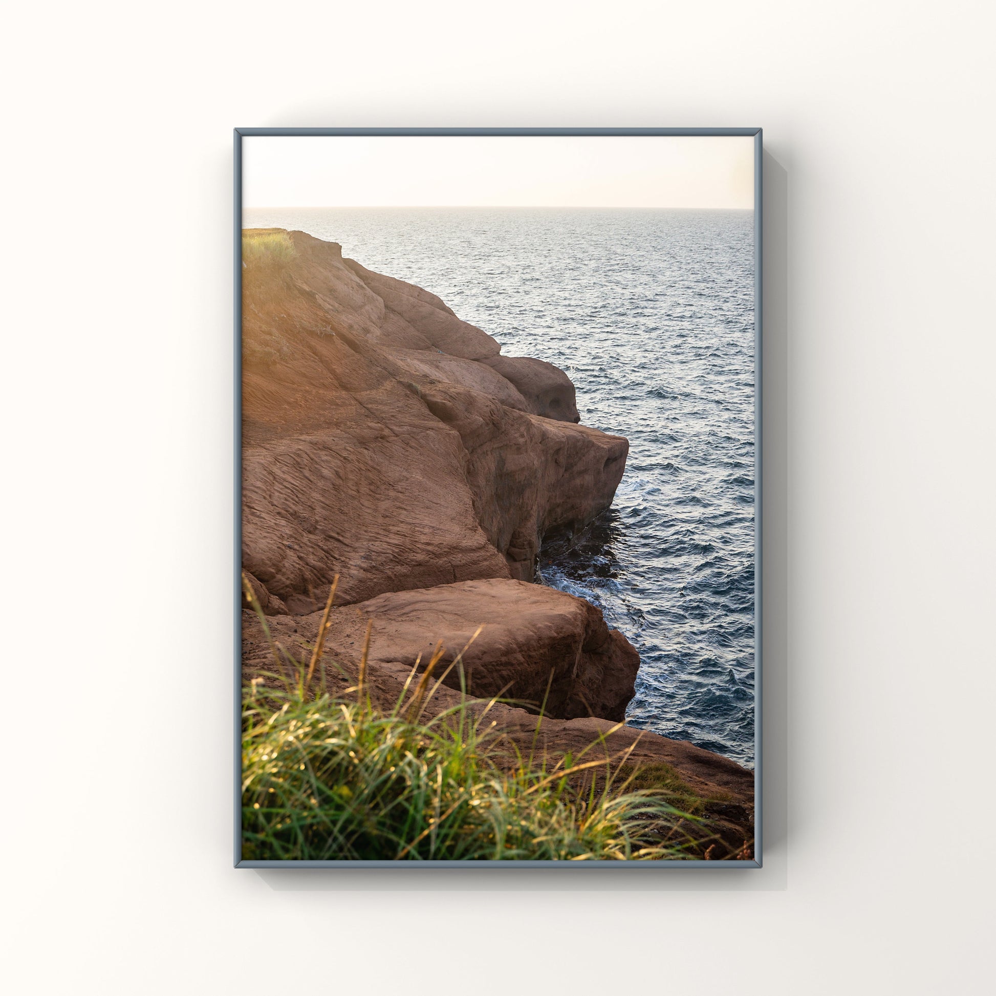 Sunset photography print of rocky cliffs in Magdalen Islands in Quebec