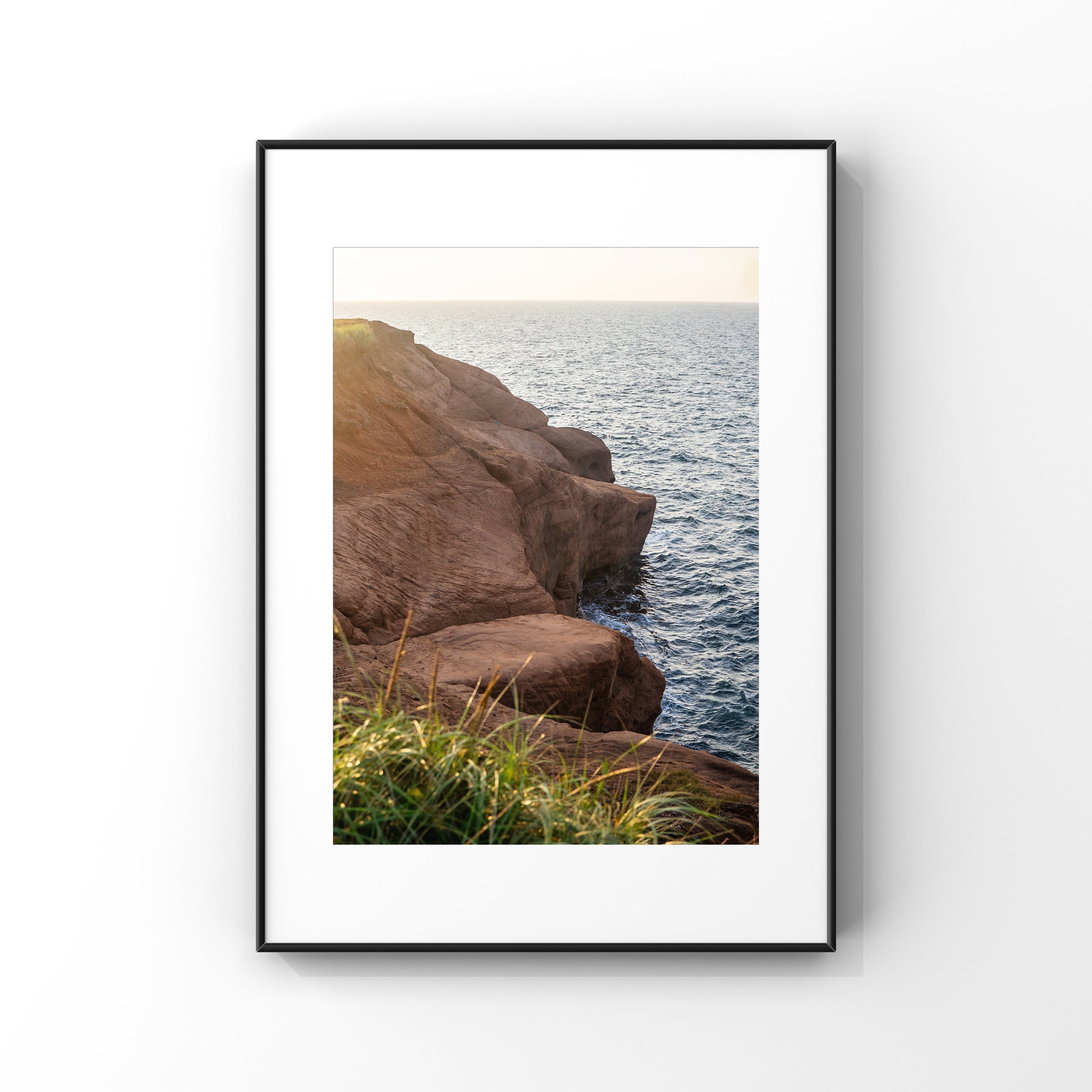 Sunset photography print of rocky cliffs in Magdalen Islands in Quebec