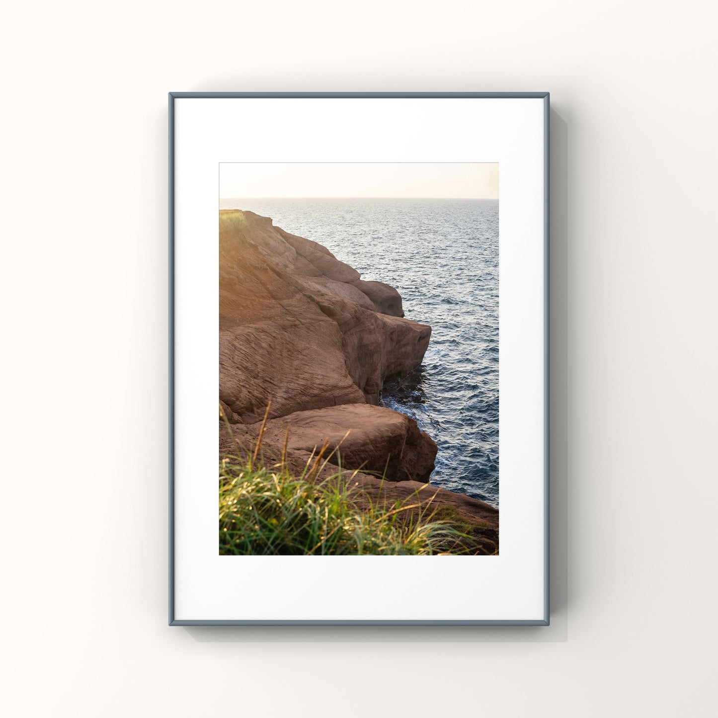 Sunset photography print of rocky cliffs in Magdalen Islands in Quebec