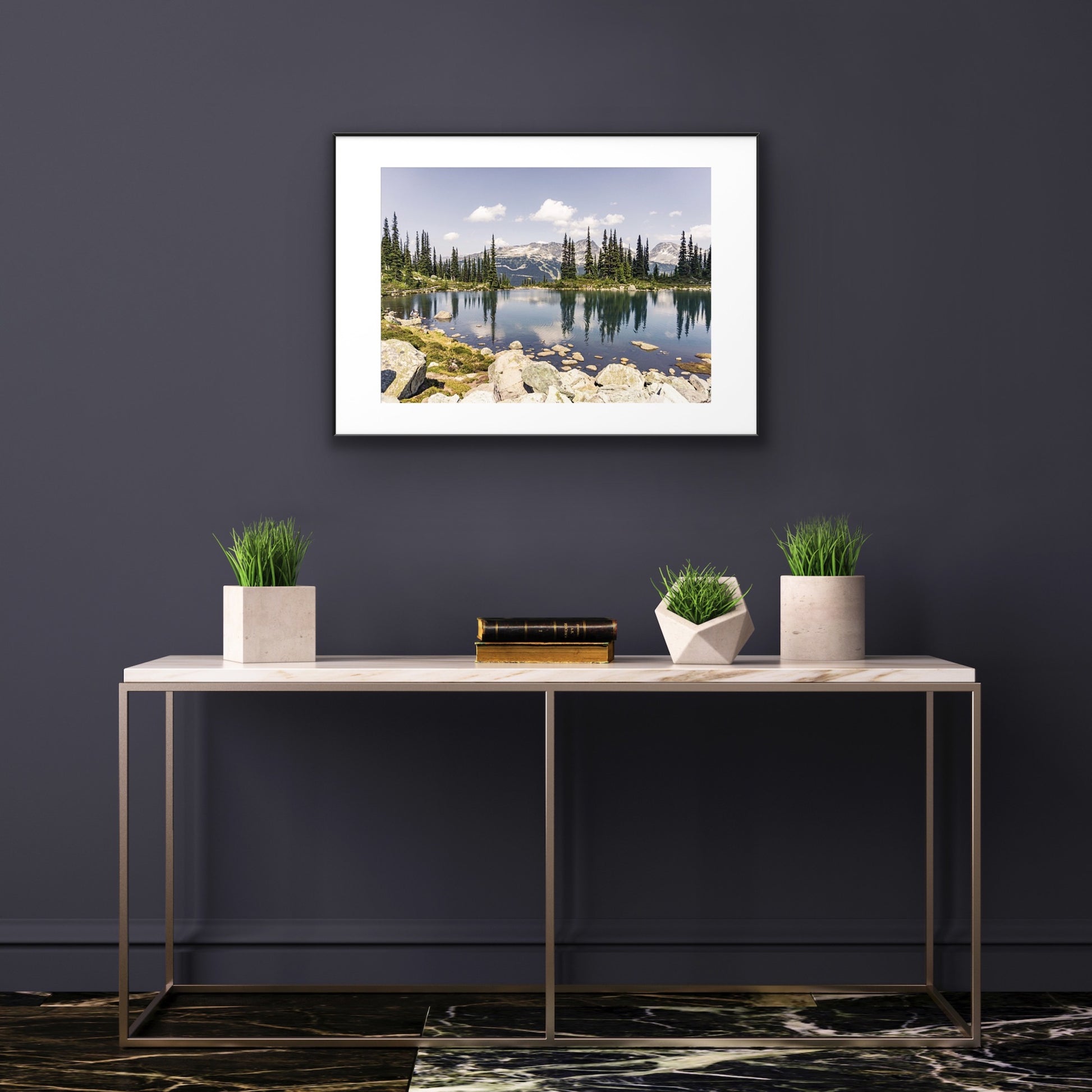 Alpine lake reflection of pine tres and mountains in Whistler, British Columbia in a framed print