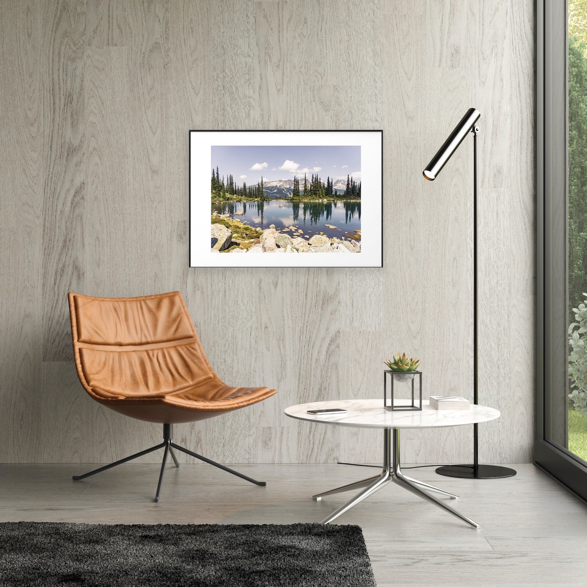 Alpine lake reflection of pine tres and mountains in Whistler, British Columbia in a framed print