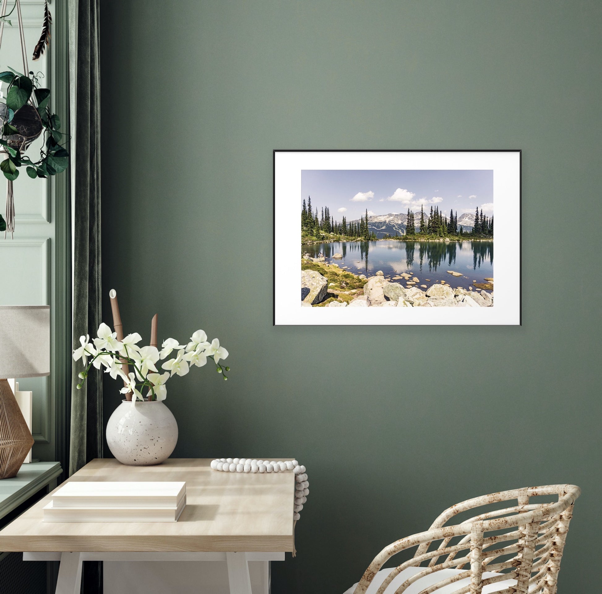 Alpine lake reflection of pine tres and mountains in Whistler, British Columbia in a framed print