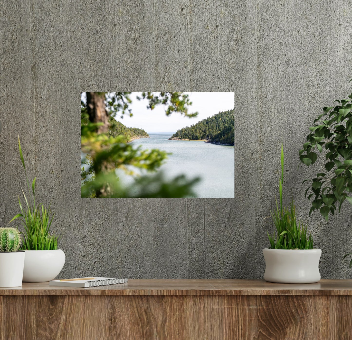 Peakaboo view through the pine trees, seeing the mountains embracing the shores of the St-Lawrence river at high tide photography print