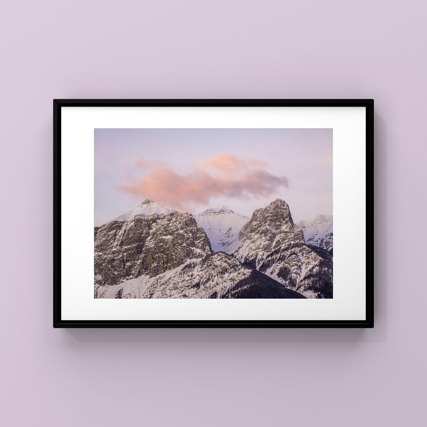 Mountain sunset photography print of a pink cloud floating over the Canadian Rocky mountains in Canmore