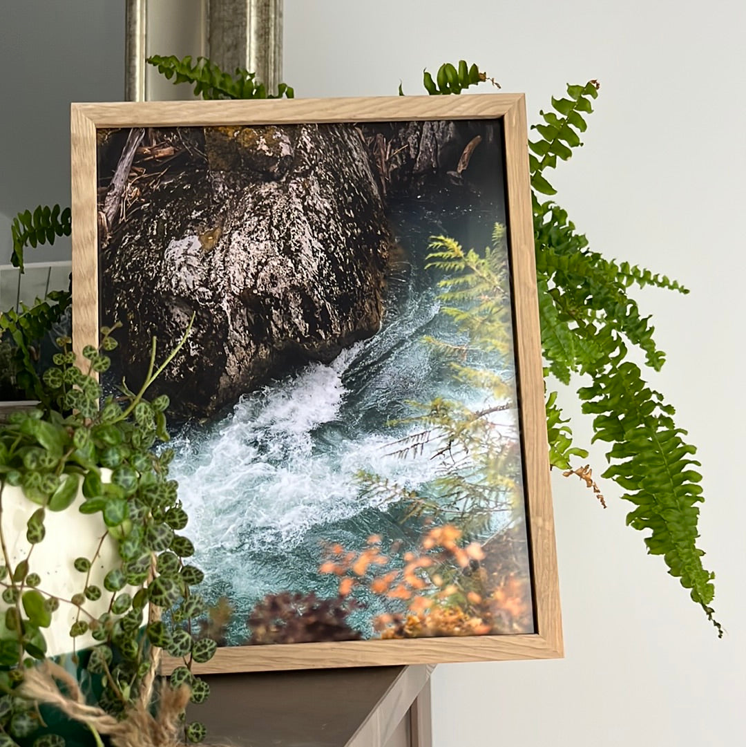 Aerial view of a glacier-fed river with surrounding nature and cliffs, photography print of Whistler, British Columbia