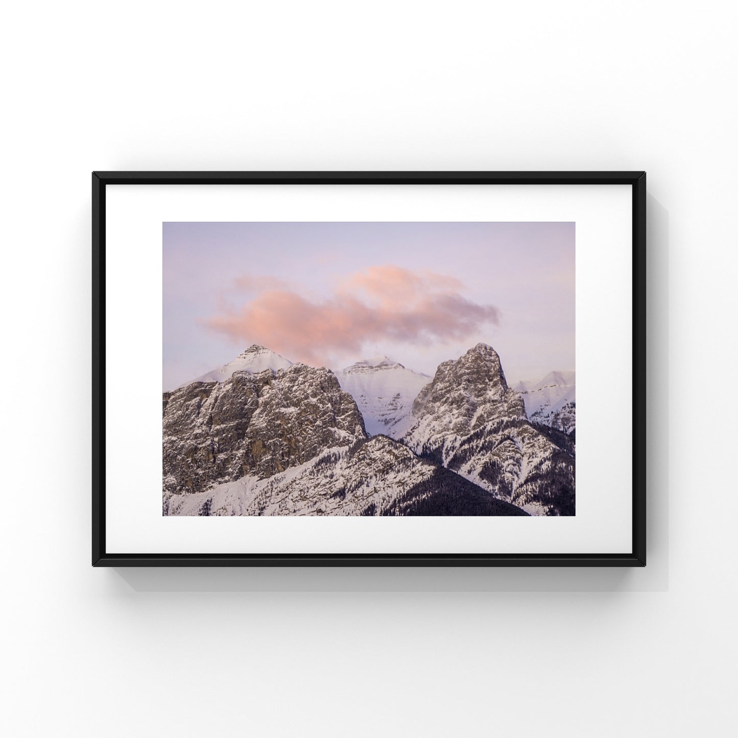 Mountain sunset photography print of a pink cloud floating over the Canadian Rocky mountains in Canmore