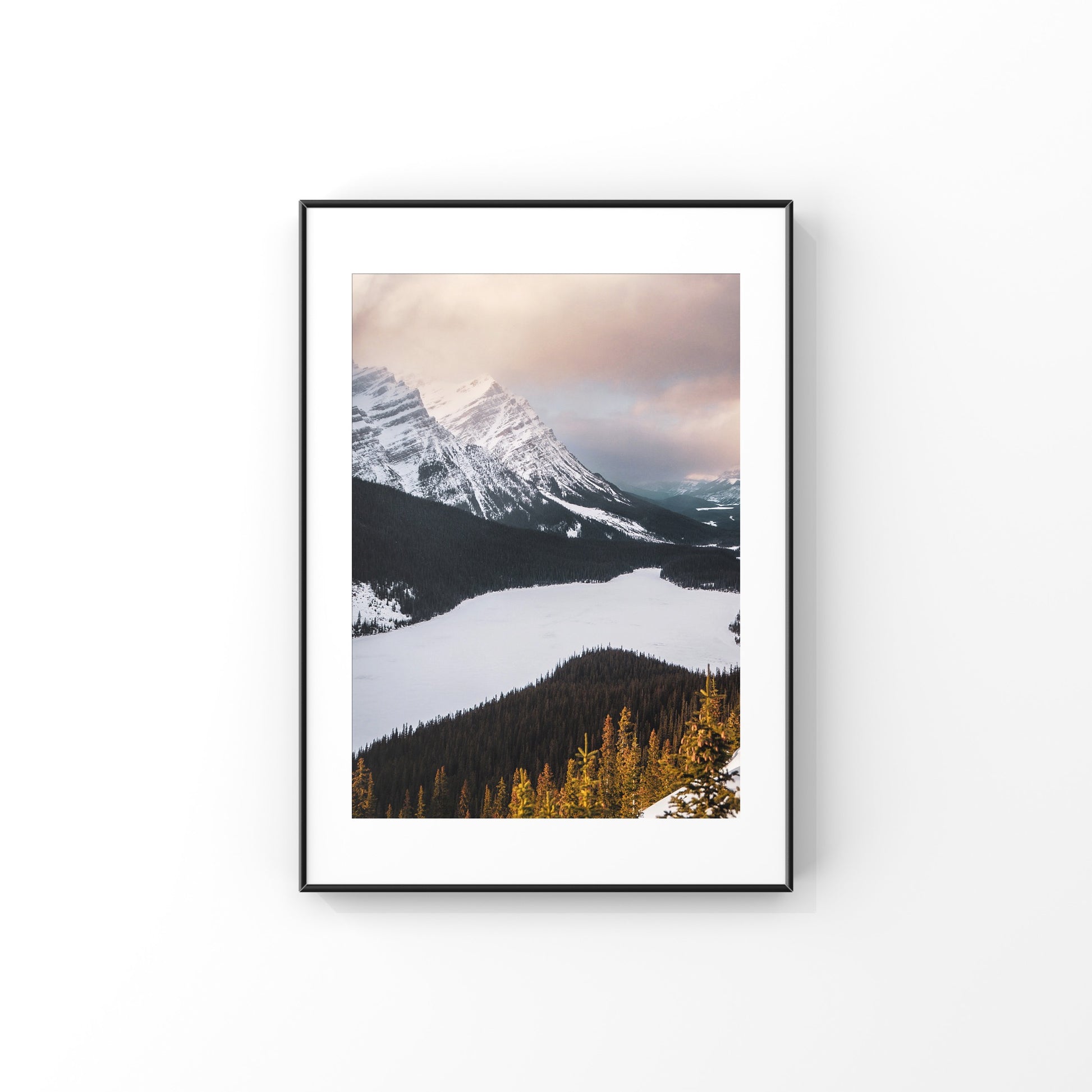 Peyto Lake at sunset in the snow with a pink sky mountain photography print in Alberta