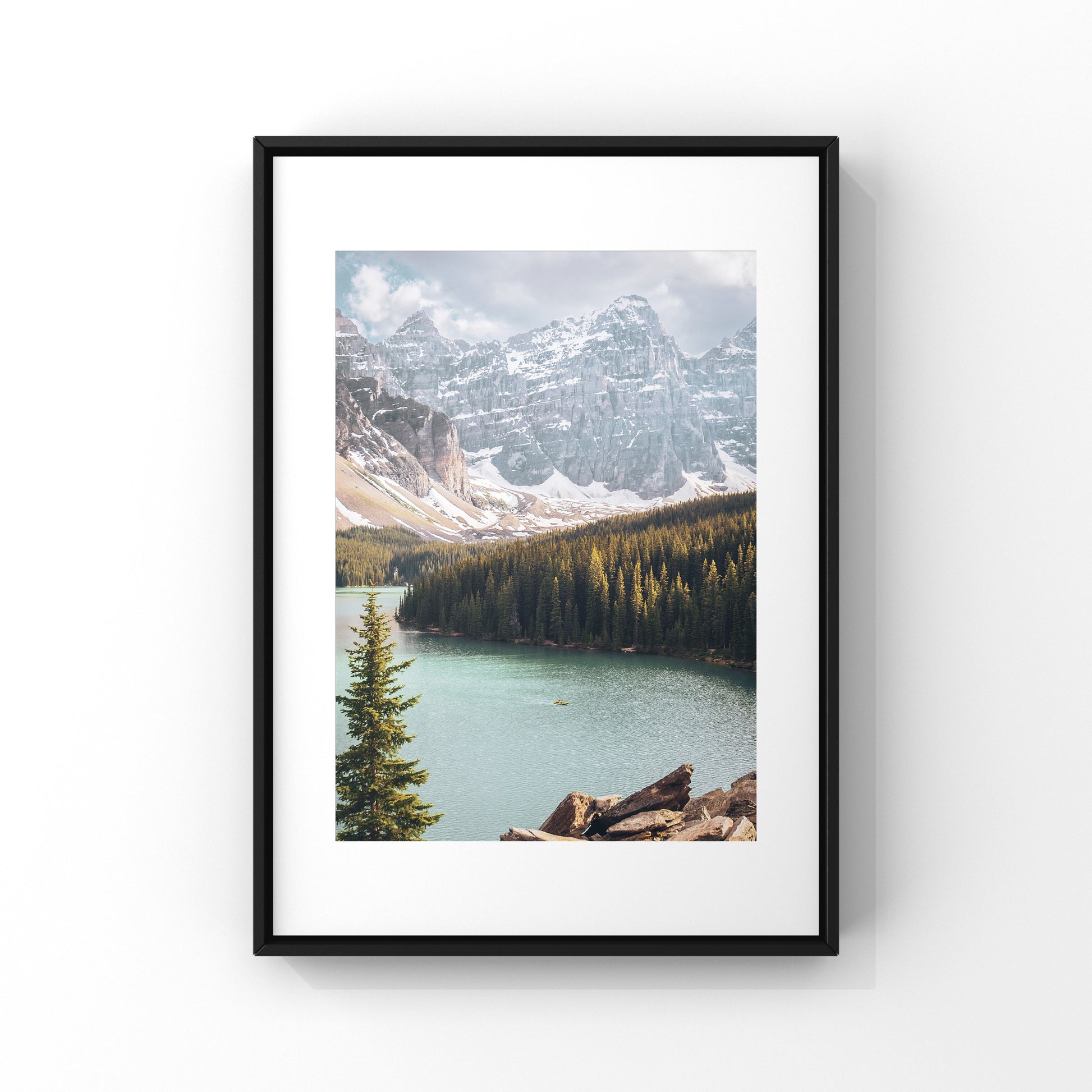 Photography print of pine trees and mountains at Moraine Lake in Alberta