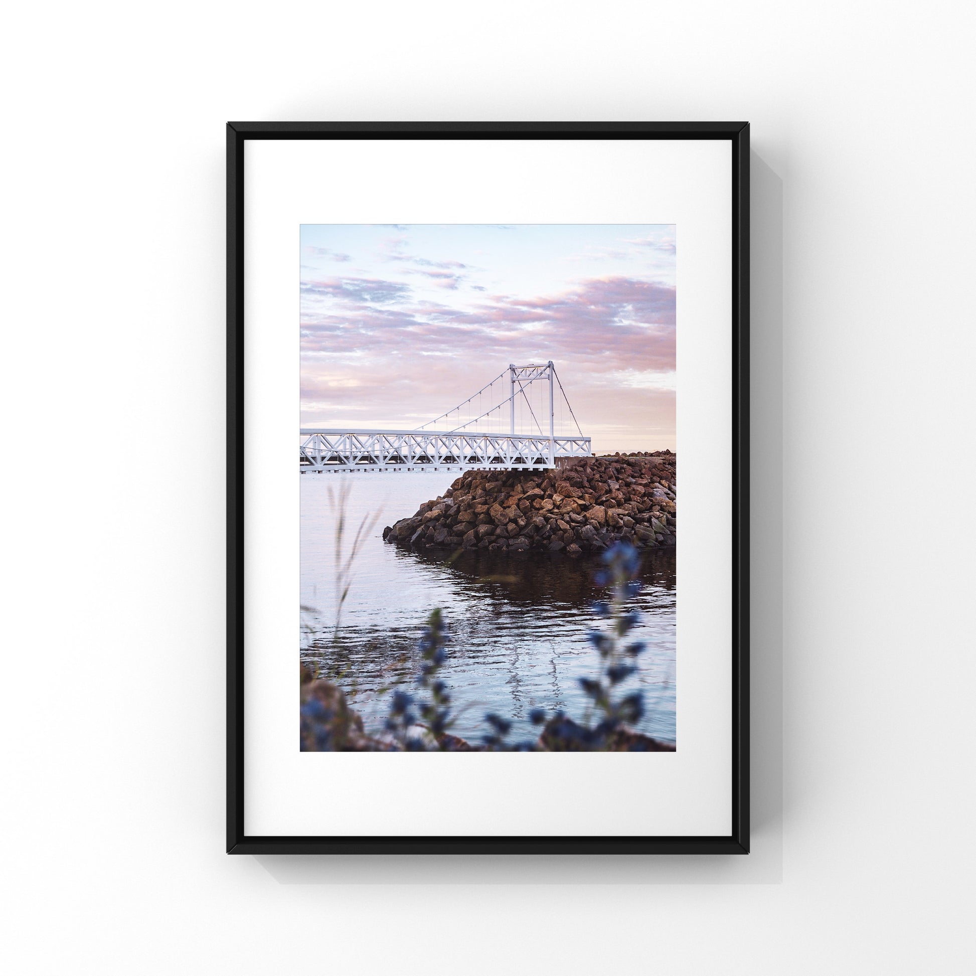 Photography print of a white bridge in a pink and lilac sunset located on the shores of the St-Lawrence river in La Malbaie